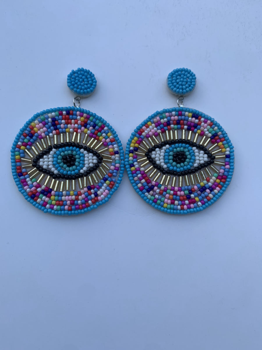 Large round disc earrings with beaded evil eye motif, gold bugle bead lashes, multicolour seed bead surround, and turquoise stud top.