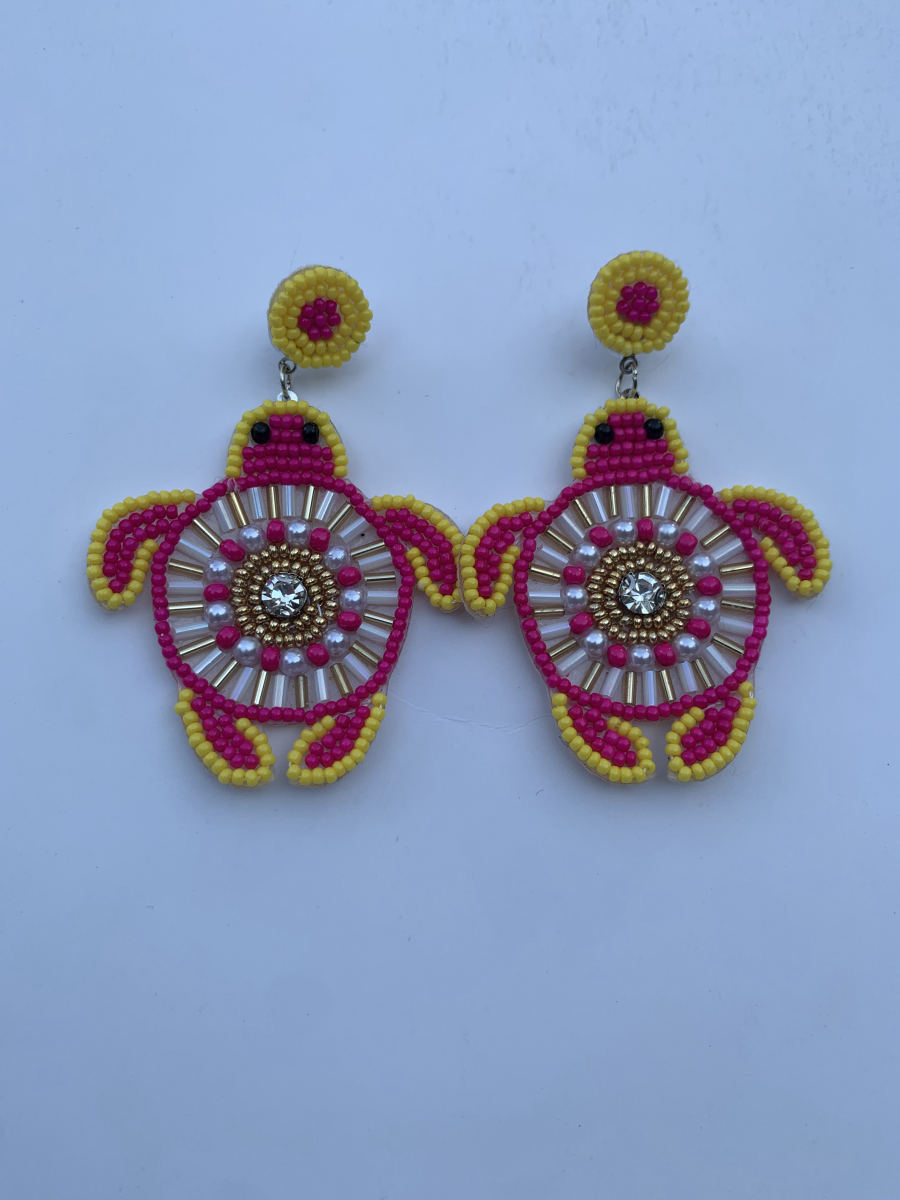 Beaded sea turtle earrings in hot pink with bugle bead and pearl shell pattern, crystal centre, and yellow round stud top.