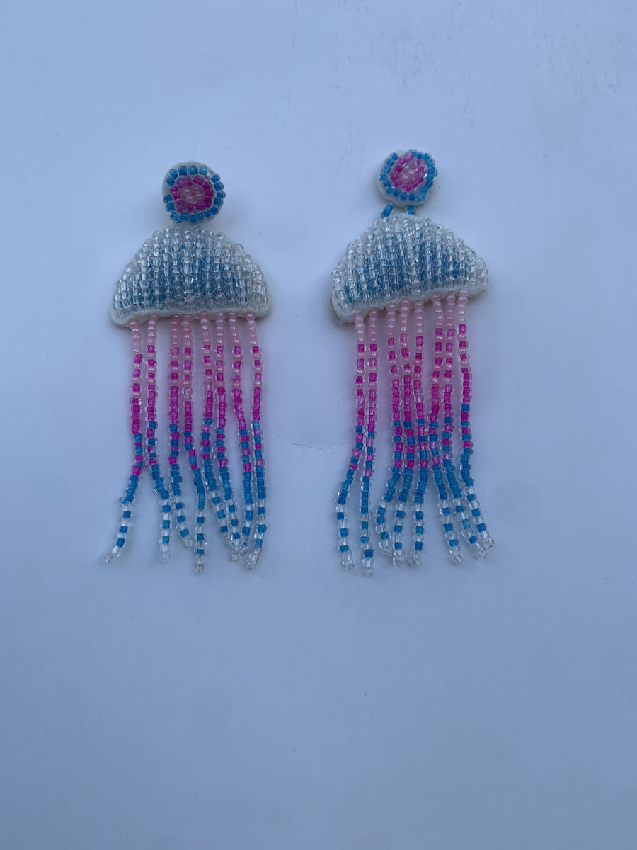 Beaded jellyfish earrings with ombre fringe tentacles transitioning from pink to sky blue to clear turquoise.