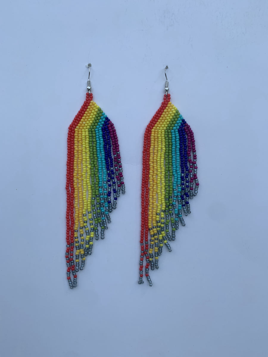 Long fringe earrings with bold vertical rainbow stripes in red, yellow, green, blue, and purple, staggered silver-tipped ends, wire hook.