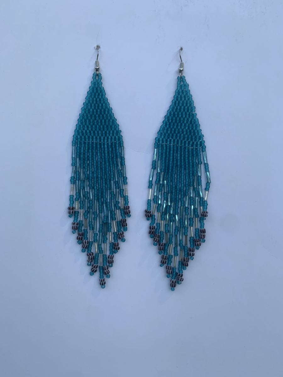 Long diamond-point fringe earrings in solid teal with clear silver bugle bead chevron accent and black-and-white patterned tip beads, wire hook.