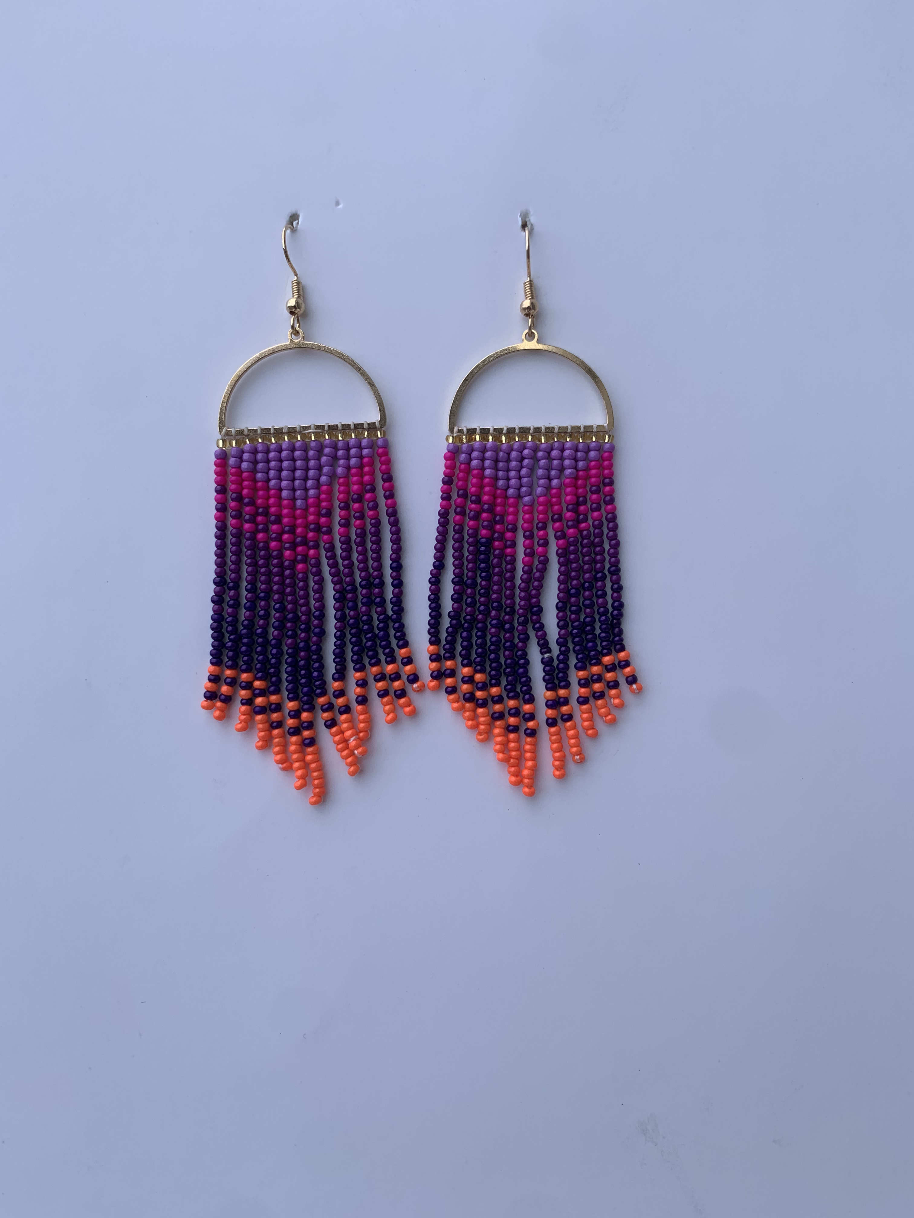 Ajumako Sunset Arc — handmade purple, orange, pink beaded fringe earrings by Rama, Ghana, Duncan BC