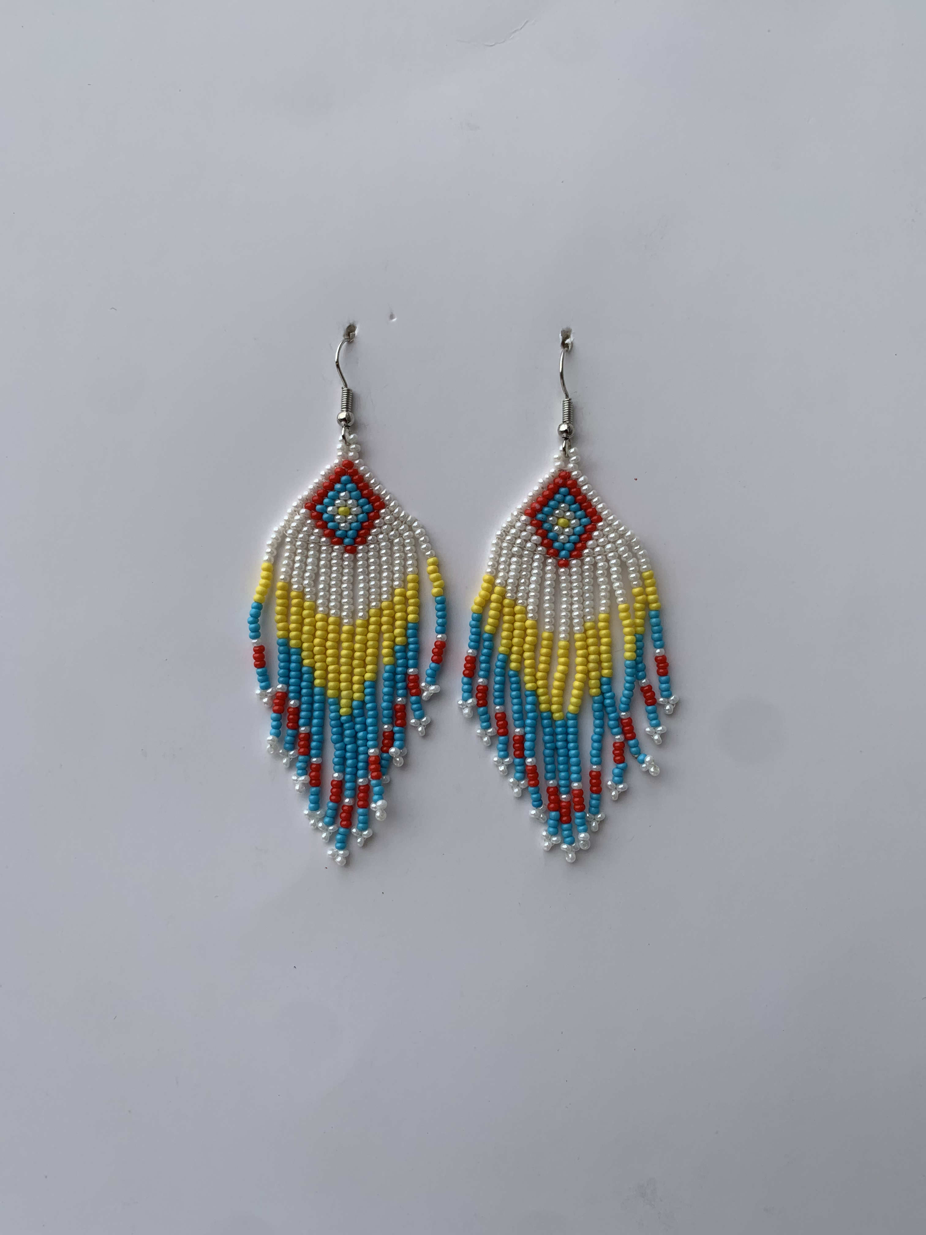 Wamfie Carnival Fringe — handmade white, blue, red beaded fringe earrings by Rama, Ghana, Duncan BC