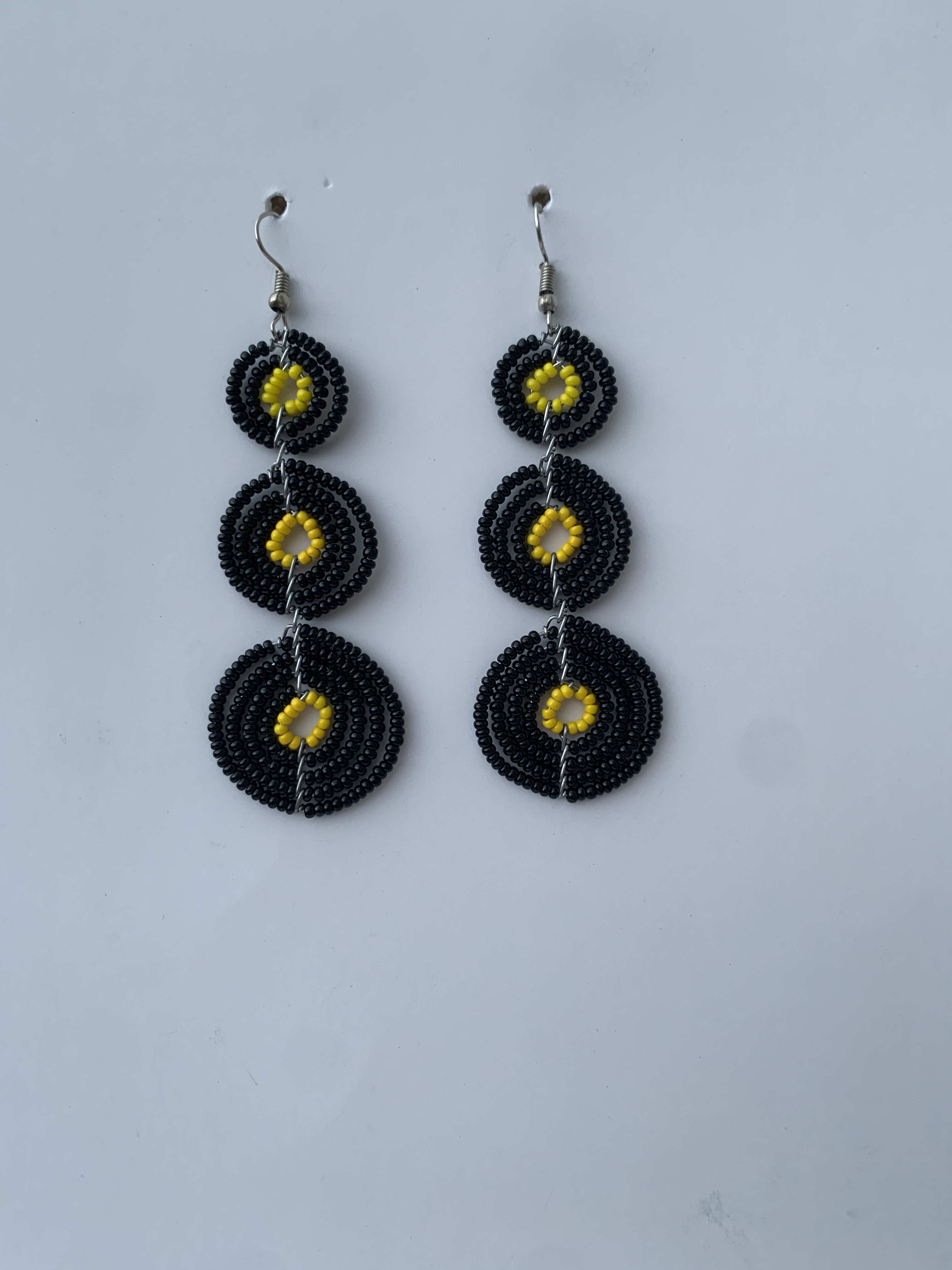 Donkorkrom Sun Discs — handmade black, gold beaded maasai earrings by Rama, Ghana, Duncan BC