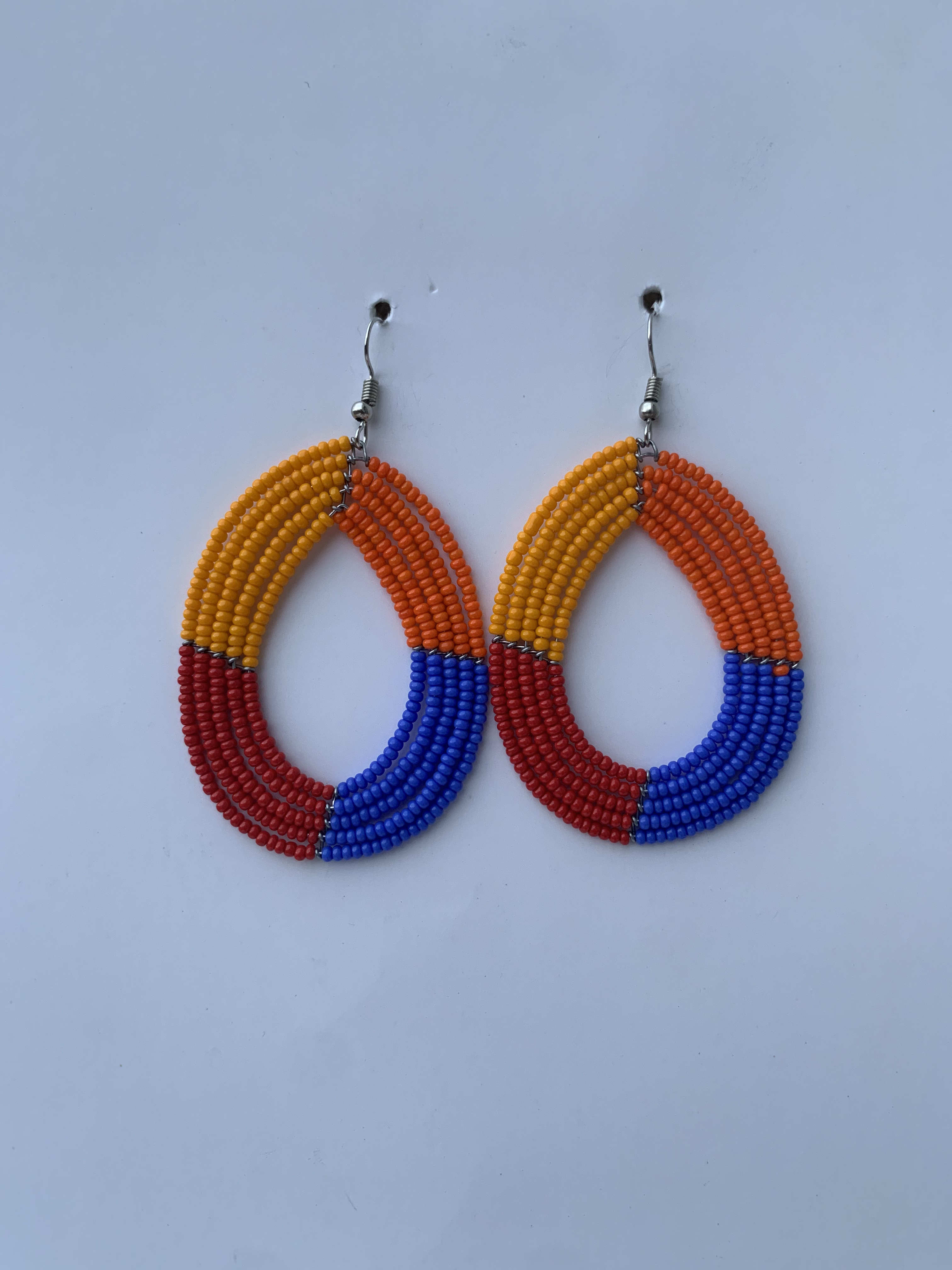 Anyinam Tribal Hoops — handmade orange, red, blue beaded maasai hoop earrings by Rama, Ghana, Duncan BC