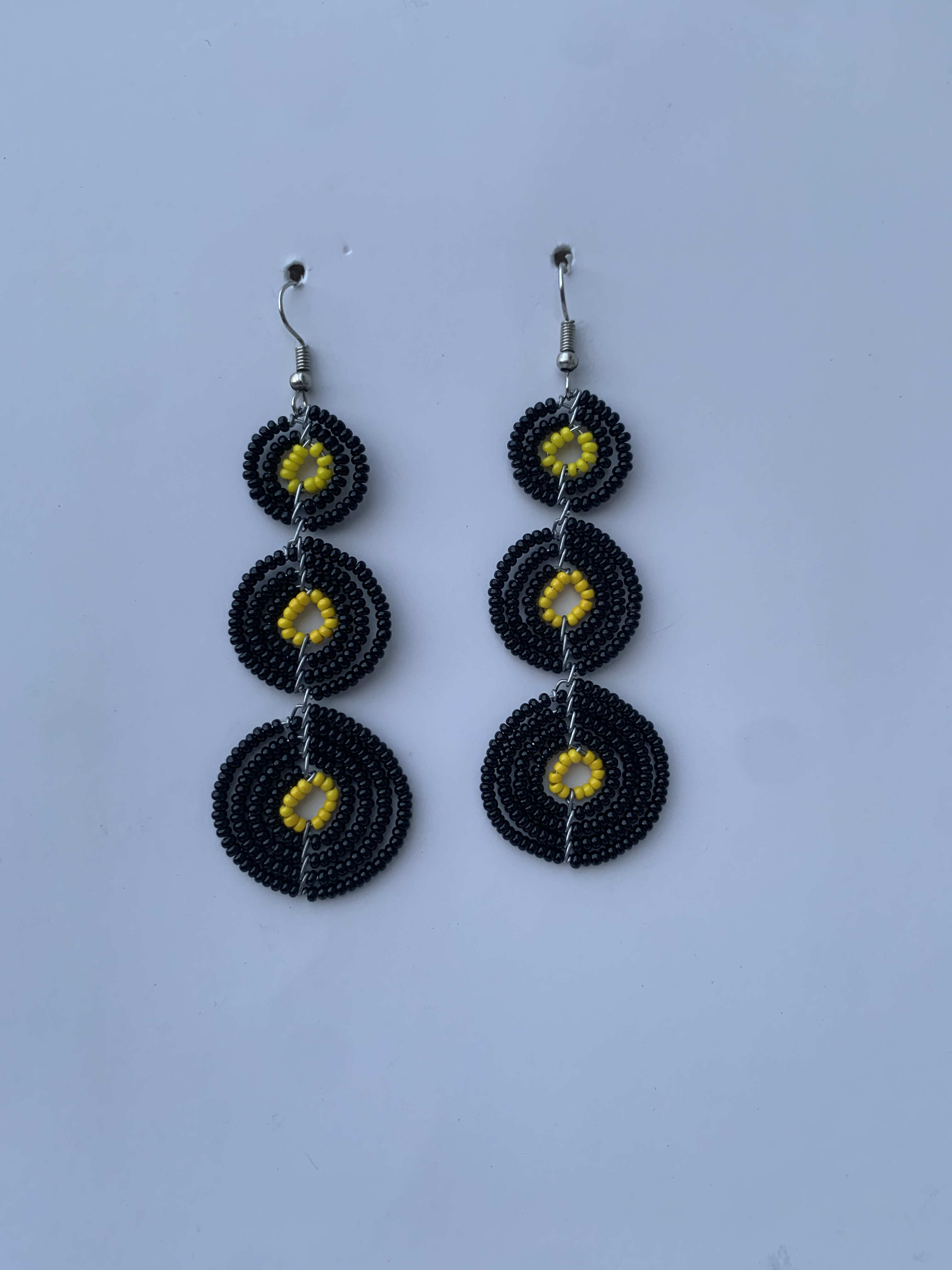Apedwa Midnight Discs — handmade black, yellow beaded maasai earrings by Rama, Ghana, Duncan BC