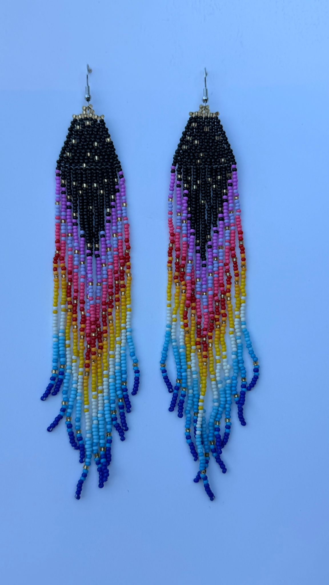 Pair of long beaded earrings with black triangular tops and multicolored fringe drops.