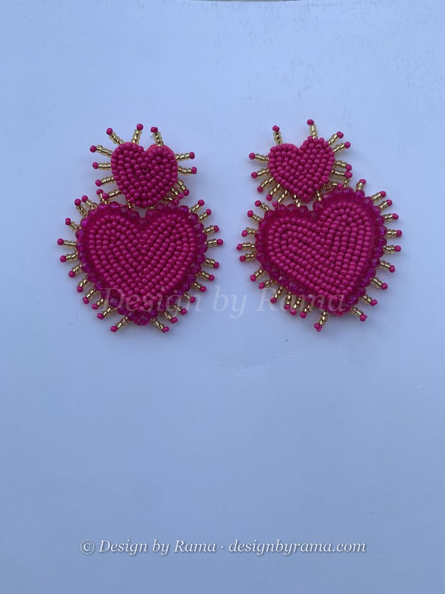 Double stacked beaded sacred heart earrings in deep fuchsia with radiating gold bugle bead spokes.