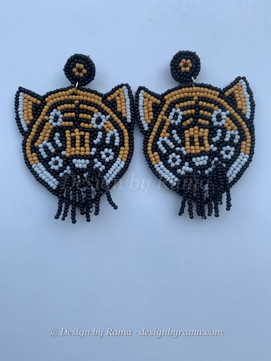 Beaded tiger face portrait earrings in amber and black with white muzzle and short black seed bead fringe beard.