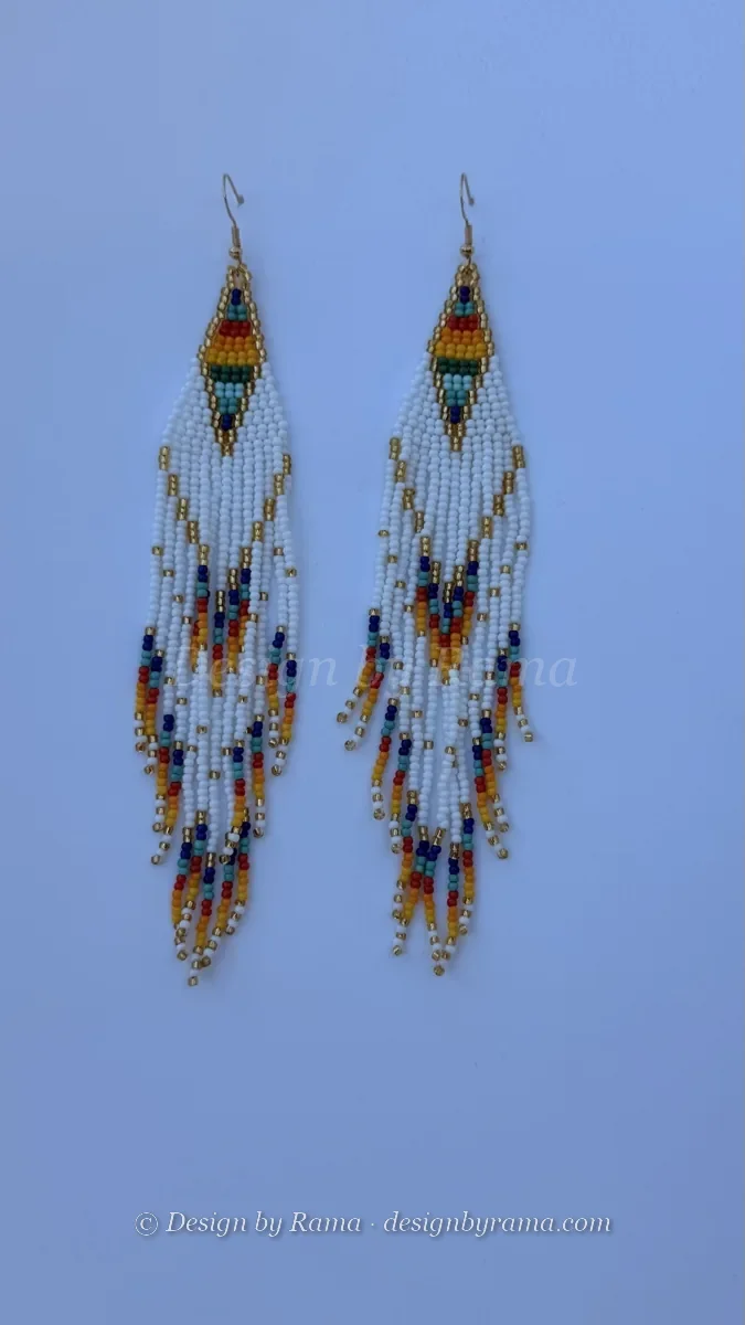 Pair of white and gold beaded triangle drop earrings with colorful fringe strands.