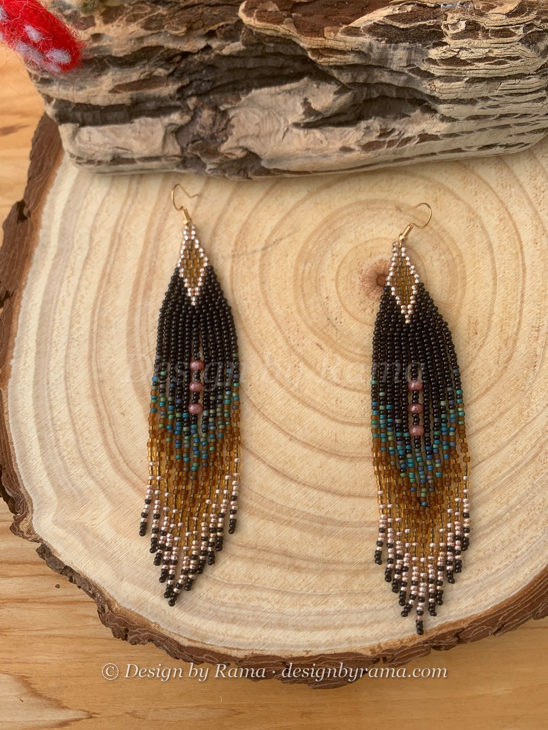 Long fringe earrings with diamond geometric lattice pattern in teal and gold on black bead ground, wire hook.