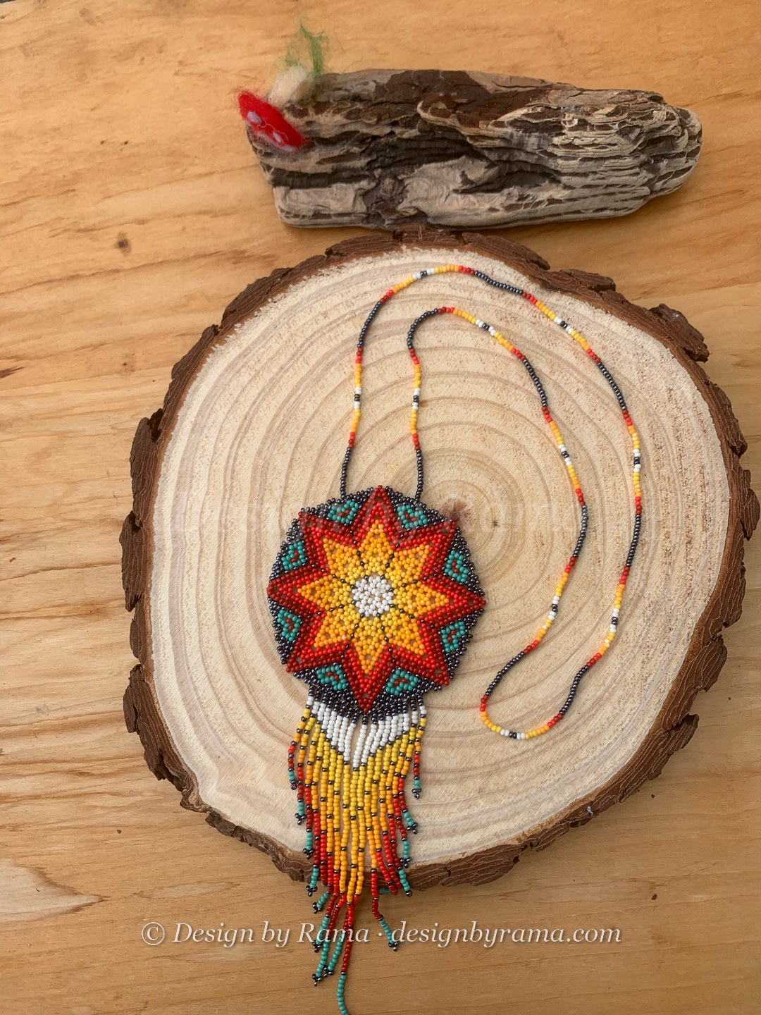 Akosombo Starburst Medallion — handmade orange, red, yellow, teal, white beaded medallion necklace by Rama, Ghana beads, Duncan BC