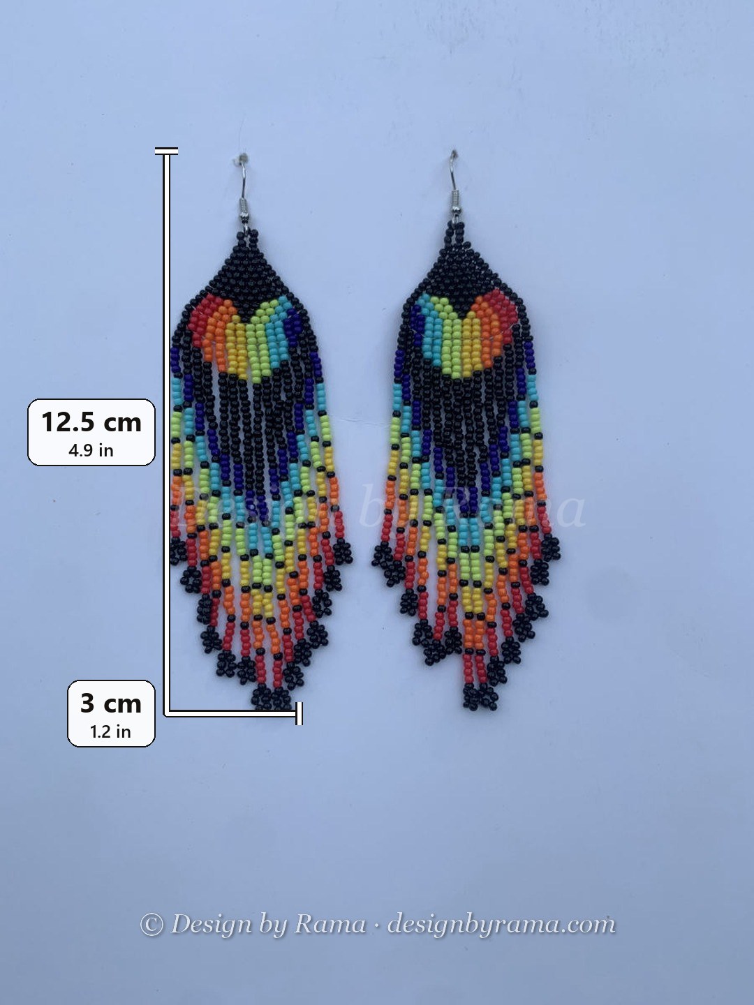 Long fringe earrings with rainbow heart motif on deep black bead ground, multicolour cascading fringe, wire hook.